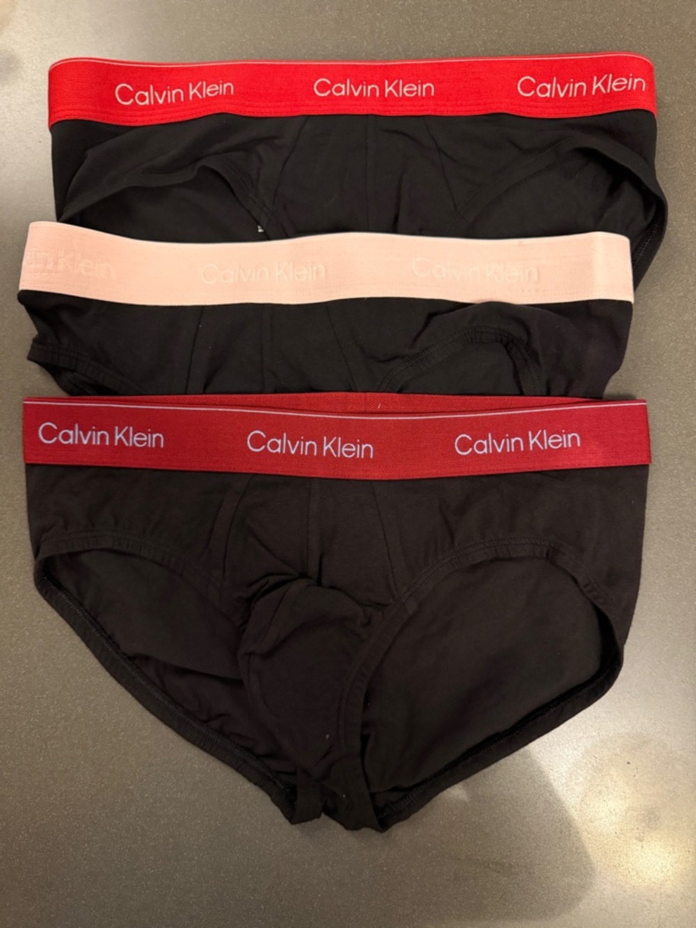 New Calvin Klein Black Hip Briefs Trio with Red and Pale Pink Waistbands. Cotton